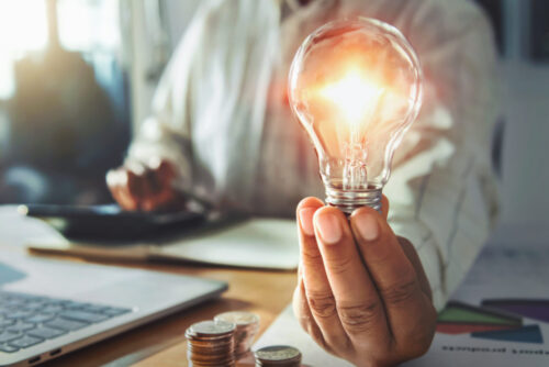 holding light bulb